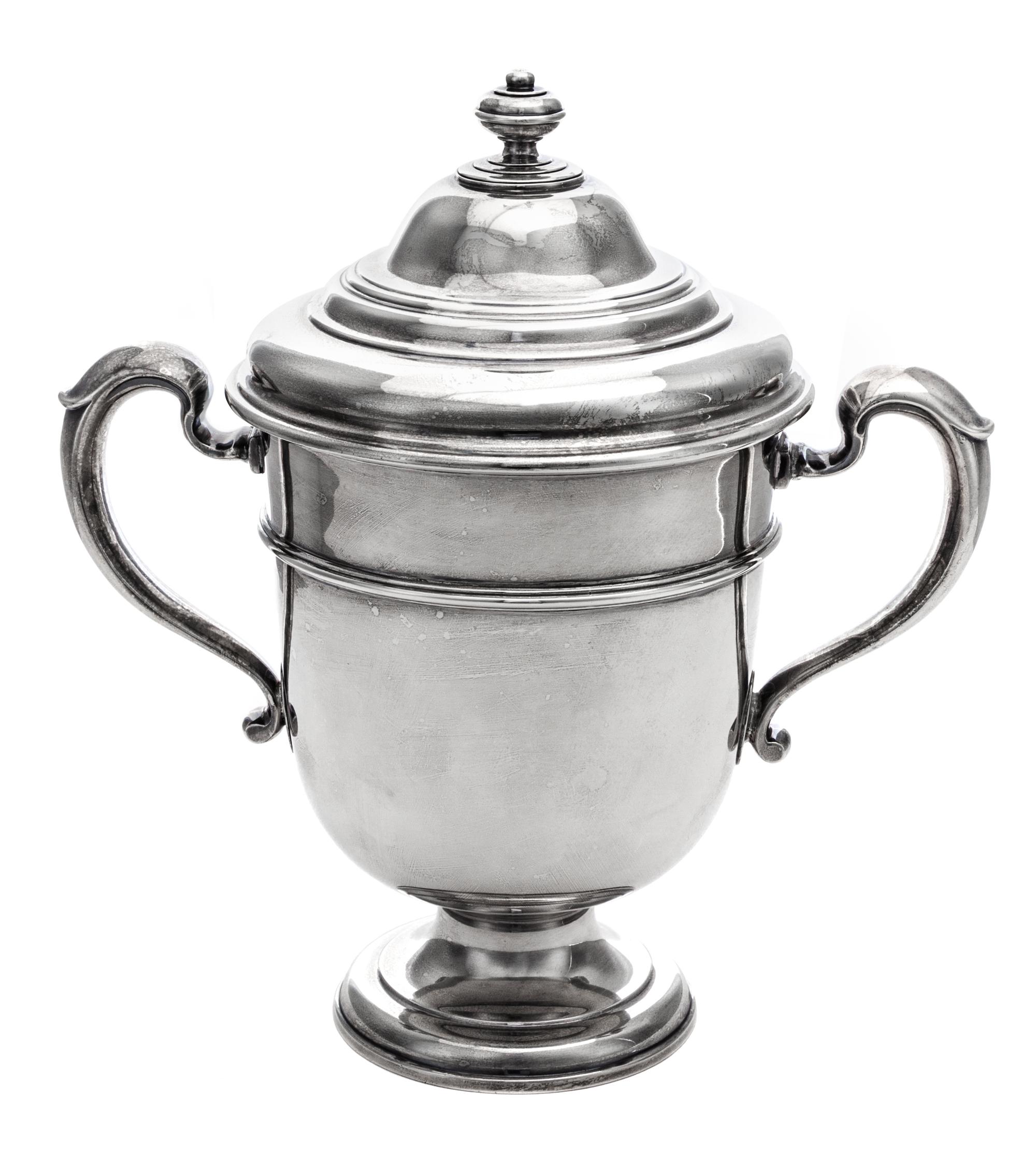 An English Silver Twin-Handled Cup and Cover, Lionel Alfred Crichton, London, 1924, the domed lid with a knopped finial above the balus