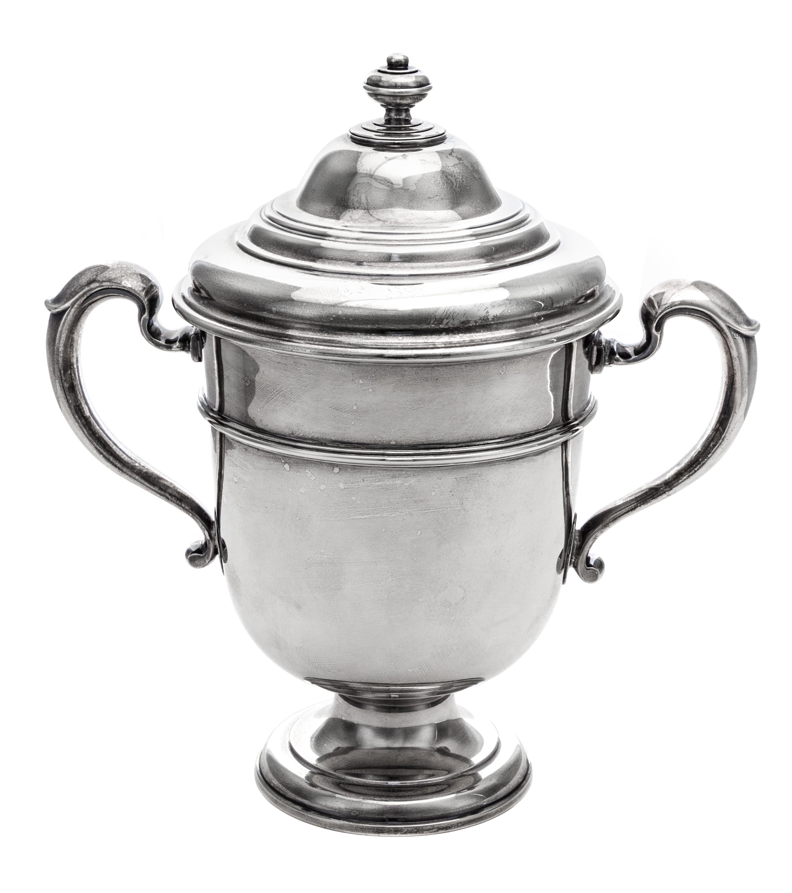 An English Silver Twin-Handled Cup and Cover, Lionel Alfred Crichton, London, 1924, the domed lid with a knopped finial above the balus