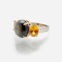 A Black Star Sapphire and Yellow Sapphire Ring