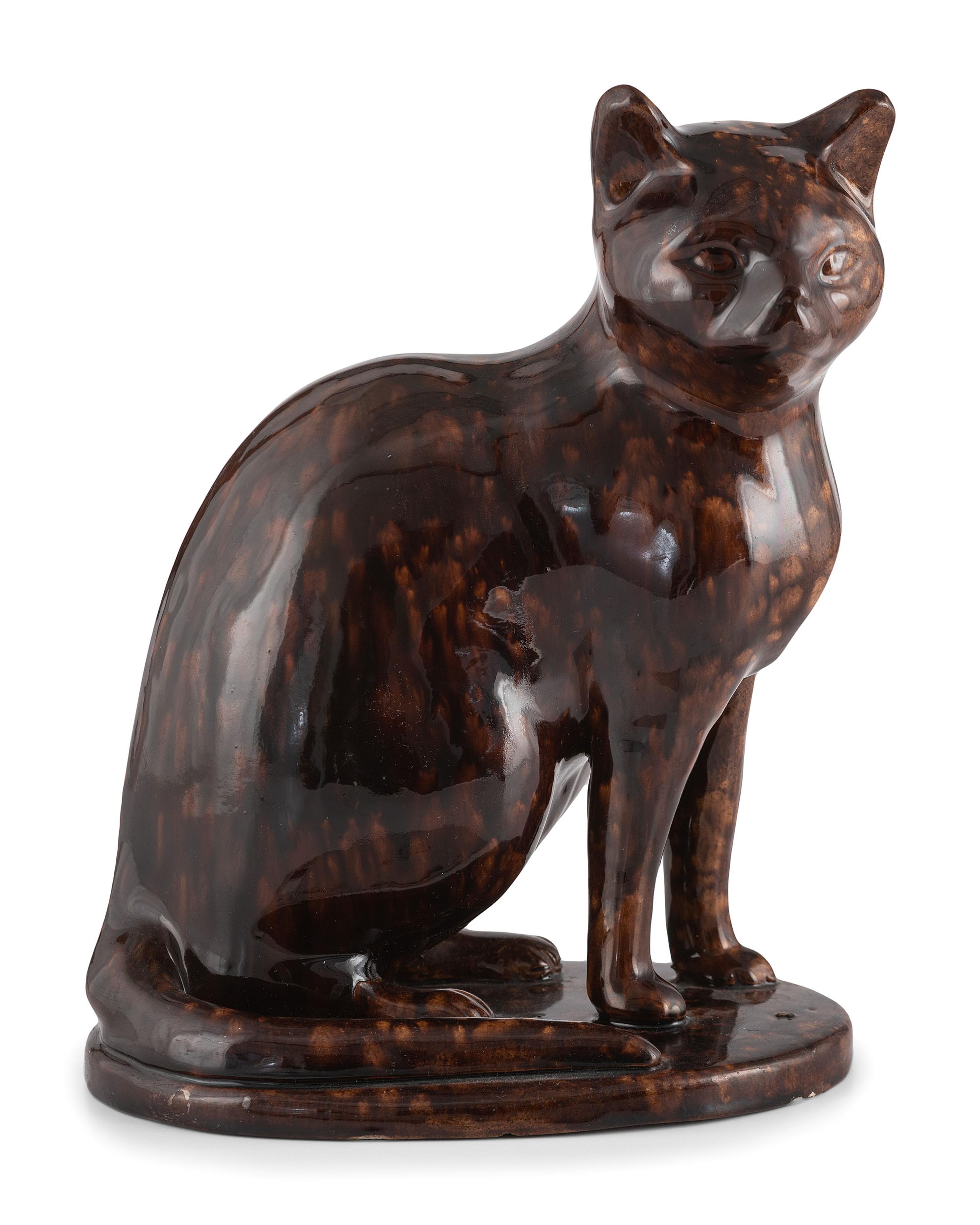 A Seated Cat Figure In Rockingham Glaze