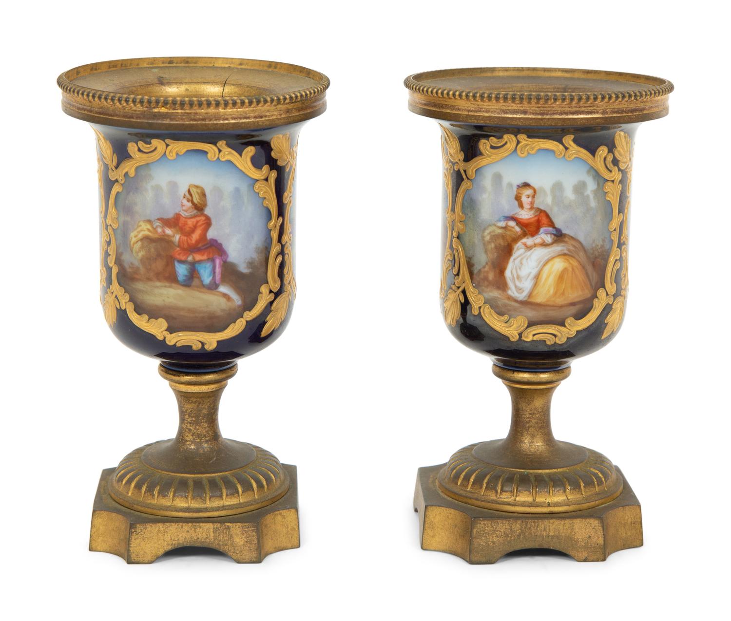 A Pair of Small Sevrés Style Porcelain and Gilt Bronze Urns