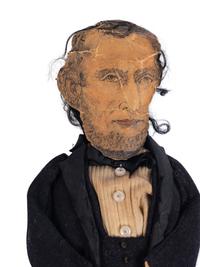 [LINCOLN-JOHNSON CAMPAIGN]. A folk art doll of Abraham Lincoln in long frock coat, ca. 1864.
