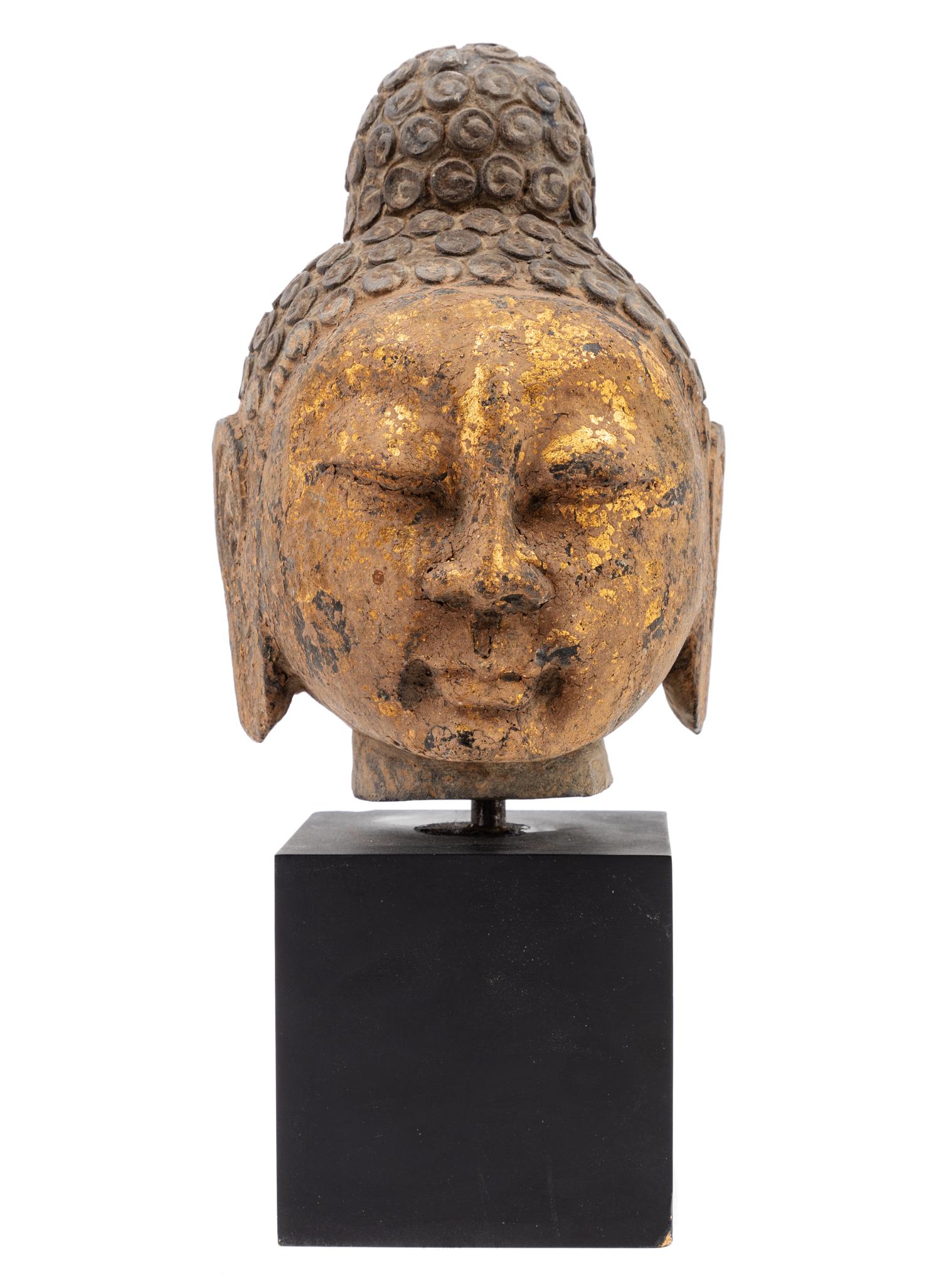 A Chinese Gilt Decorated Stone Head