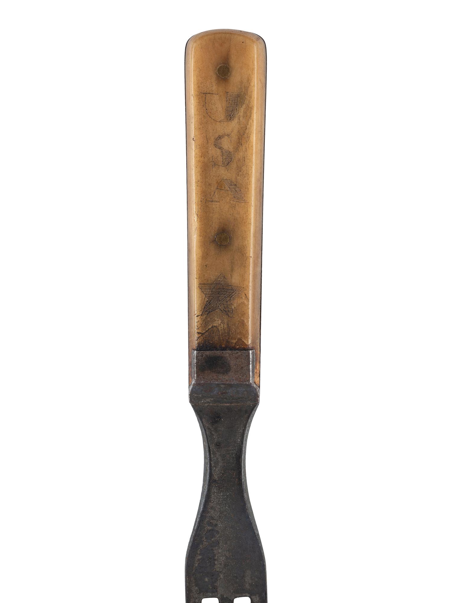 [CIVIL WAR]. A group of 7 items used by a soldier in the field, incl. US issued military cup, Navy fuse pouch, pistol cartridge box, bone handled fork, mirror with patriotic motif, and two dug spurs from the battlefield.