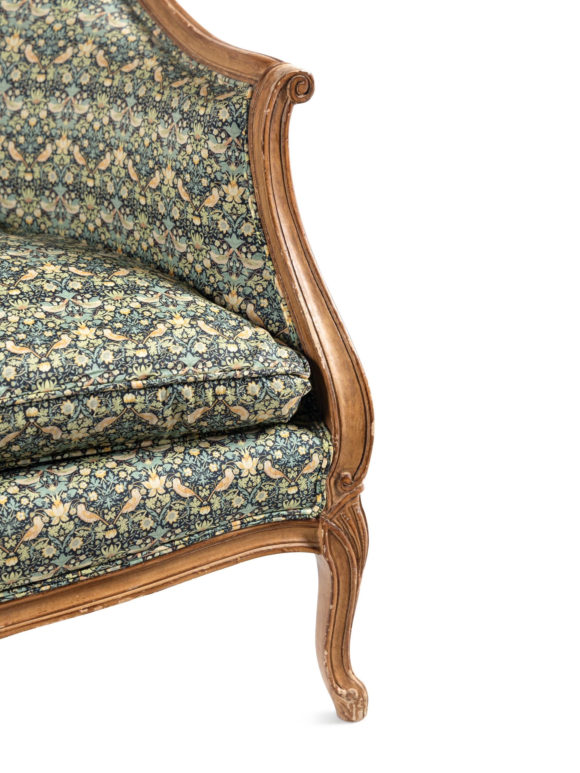 A Louis XV Style Settee with Strawberry Thief Upholstery