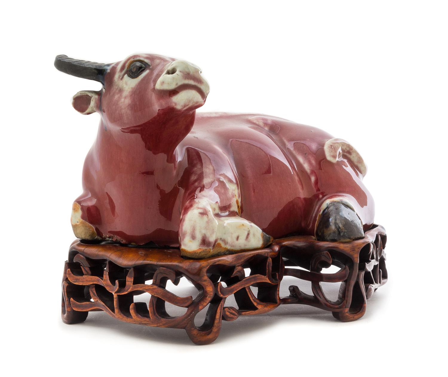 A Copper Red Glazed Porcelain Figure of a Water Buffalo Height 6 3/4 inches. — 19TH CENTURY