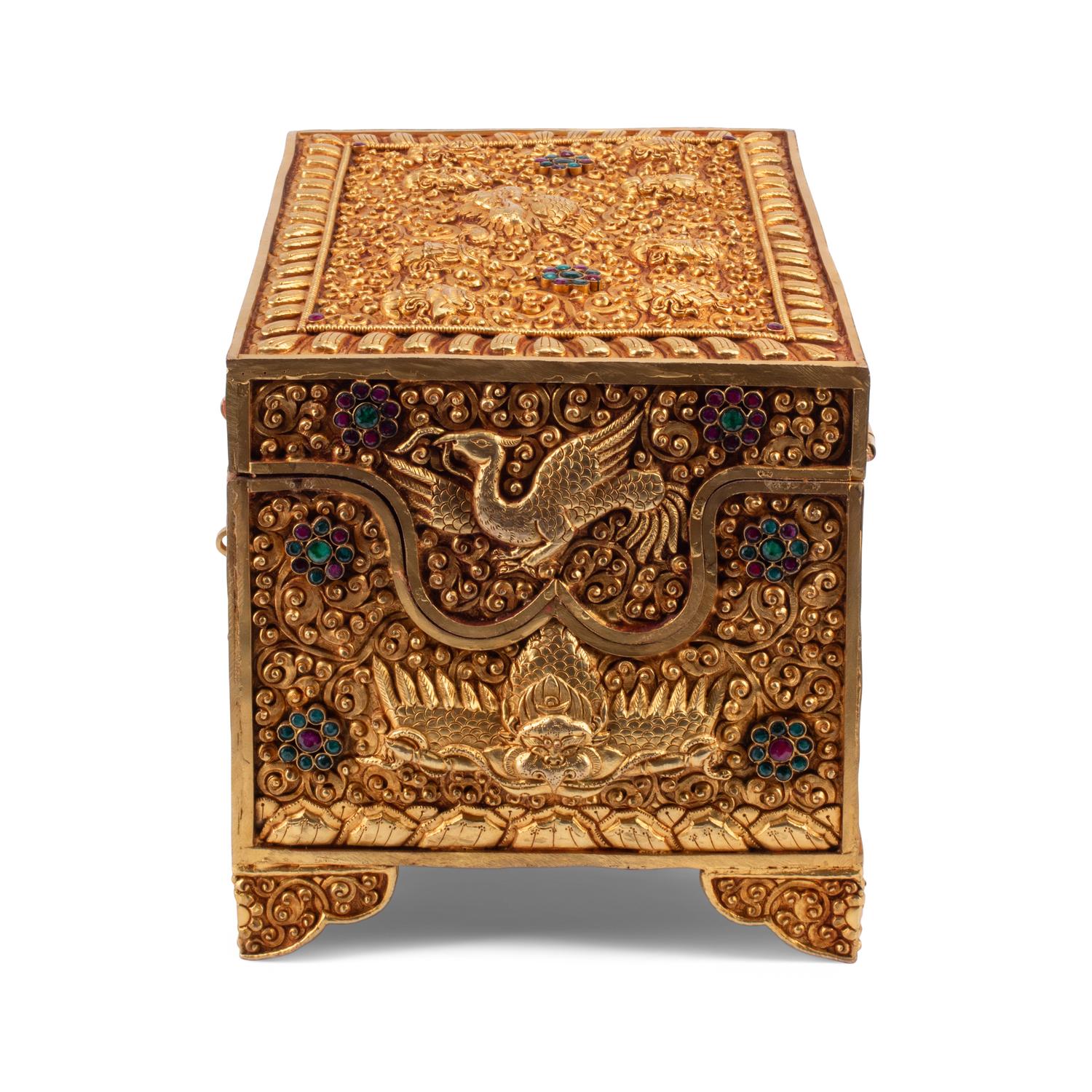 A Tibetan Style Gilt Metal, Emerald and Ruby Mounted Table Casket