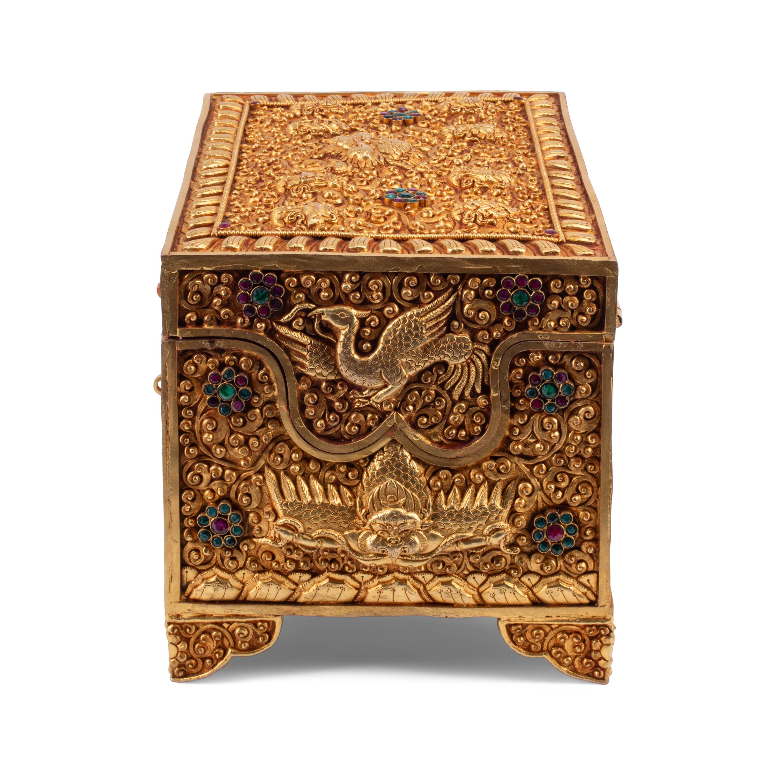 A Tibetan Style Gilt Metal, Emerald and Ruby Mounted Table Casket