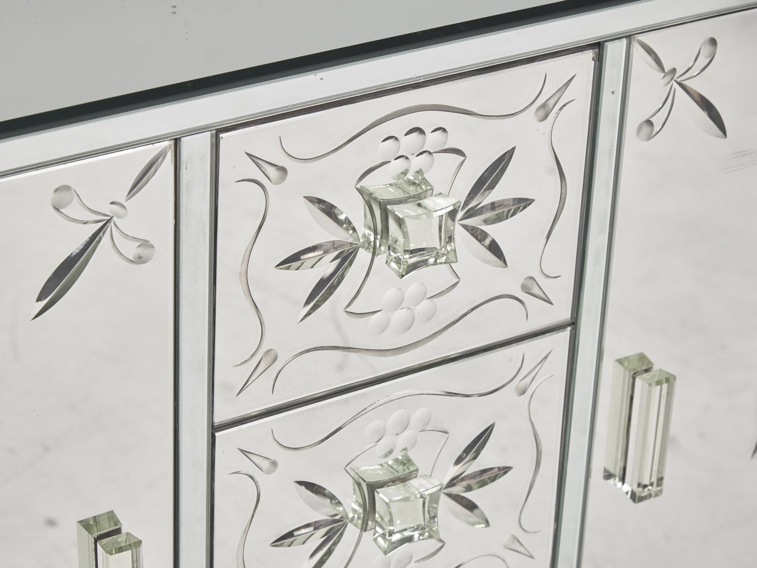 An Art Deco Etched Glass and Ebonized Mirrored Sideboard