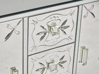 An Art Deco Etched Glass and Ebonized Mirrored Sideboard