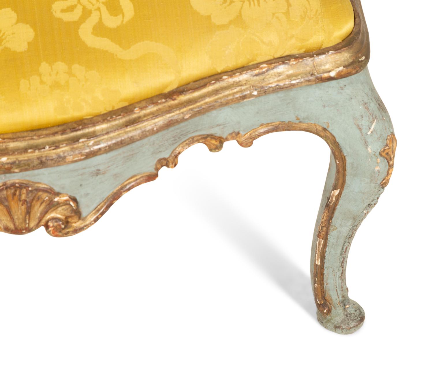 An Italian Rococo Painted and Parcel Gilt Open Armchair