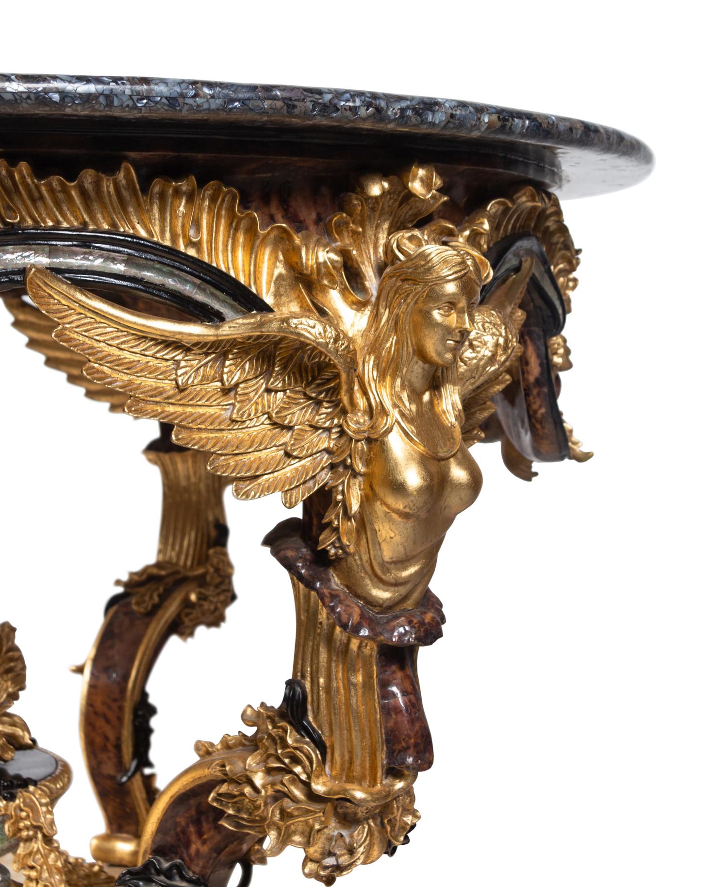 A Continental Parcel Gilt and Ebonized, Pietra Dura and Abalone Inlaid Center Table