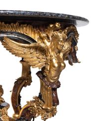 A Continental Parcel Gilt and Ebonized, Pietra Dura and Abalone Inlaid Center Table