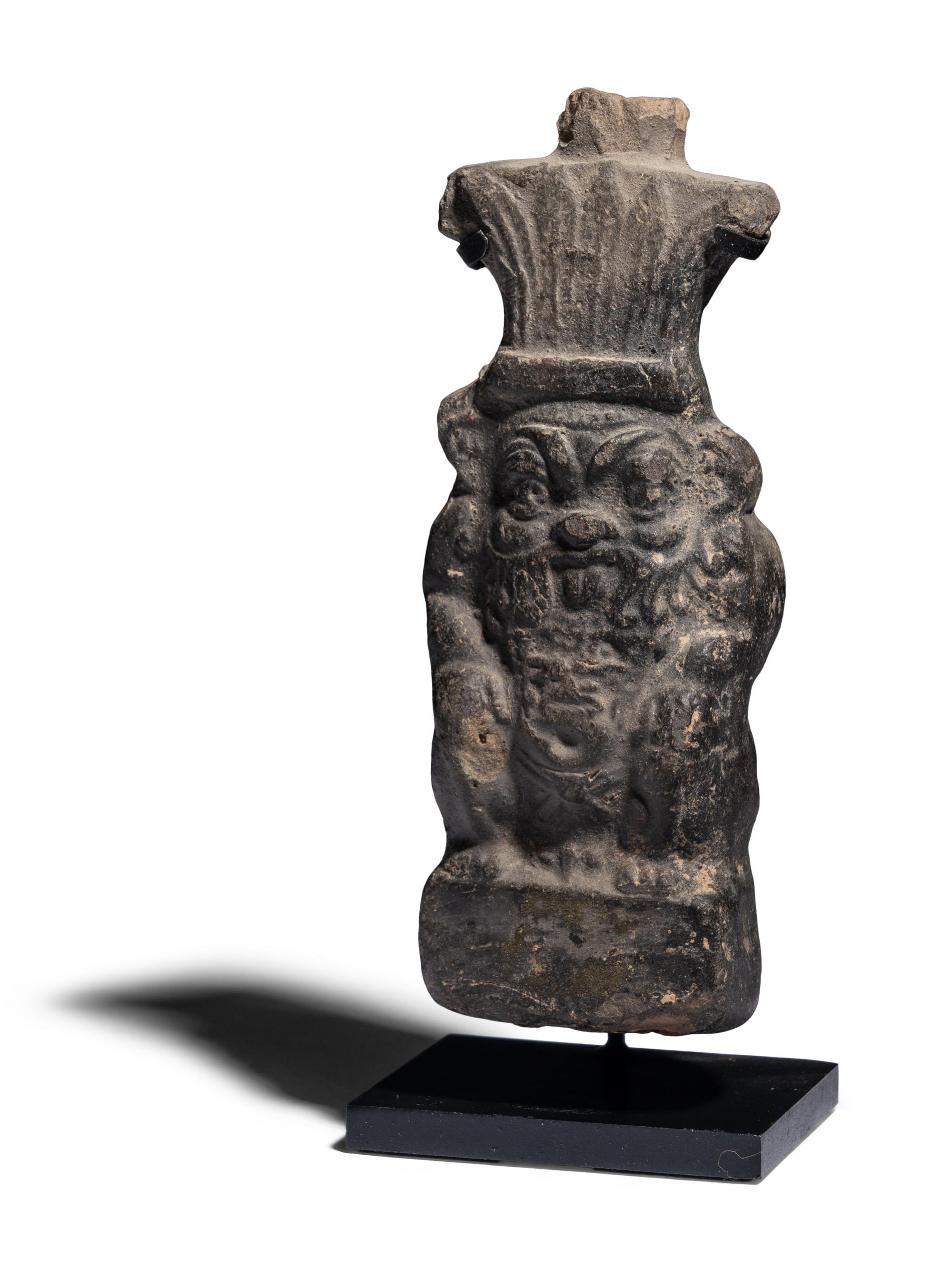 An Egyptian Terracotta Vessel in the form of Bes