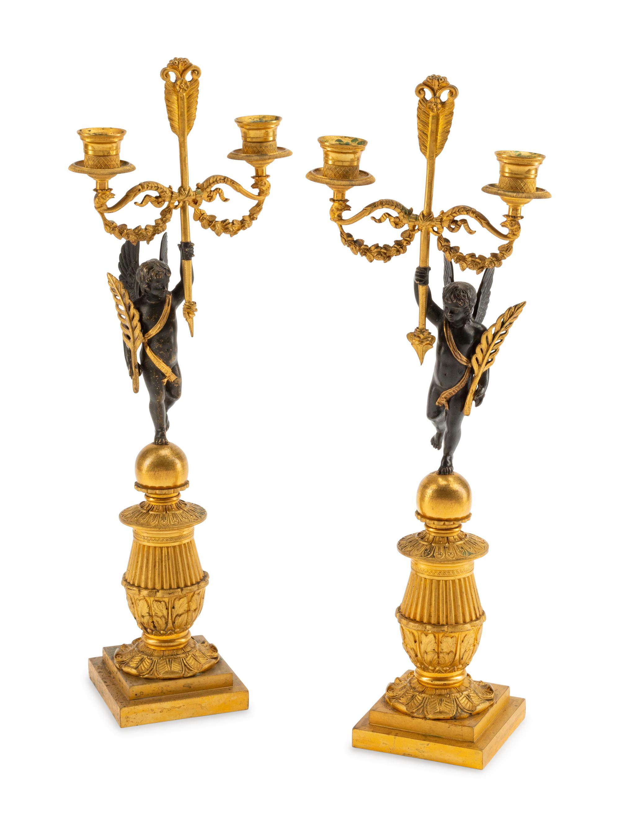 A Pair of Empire Style Gilt and Patinated Bronze Figural Two-Light Candelabra