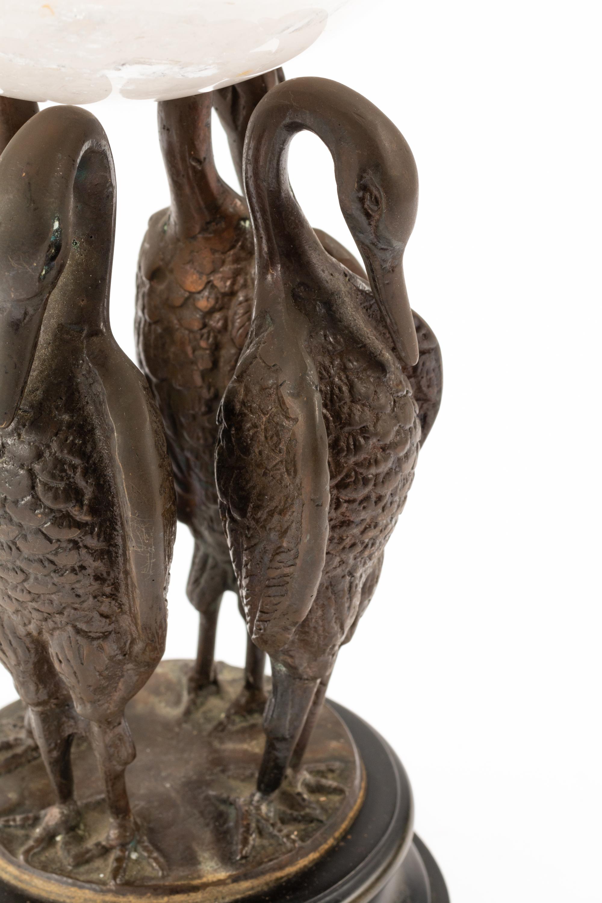 A Rock Crystal Spherical Ornament on a Bird Motif Base