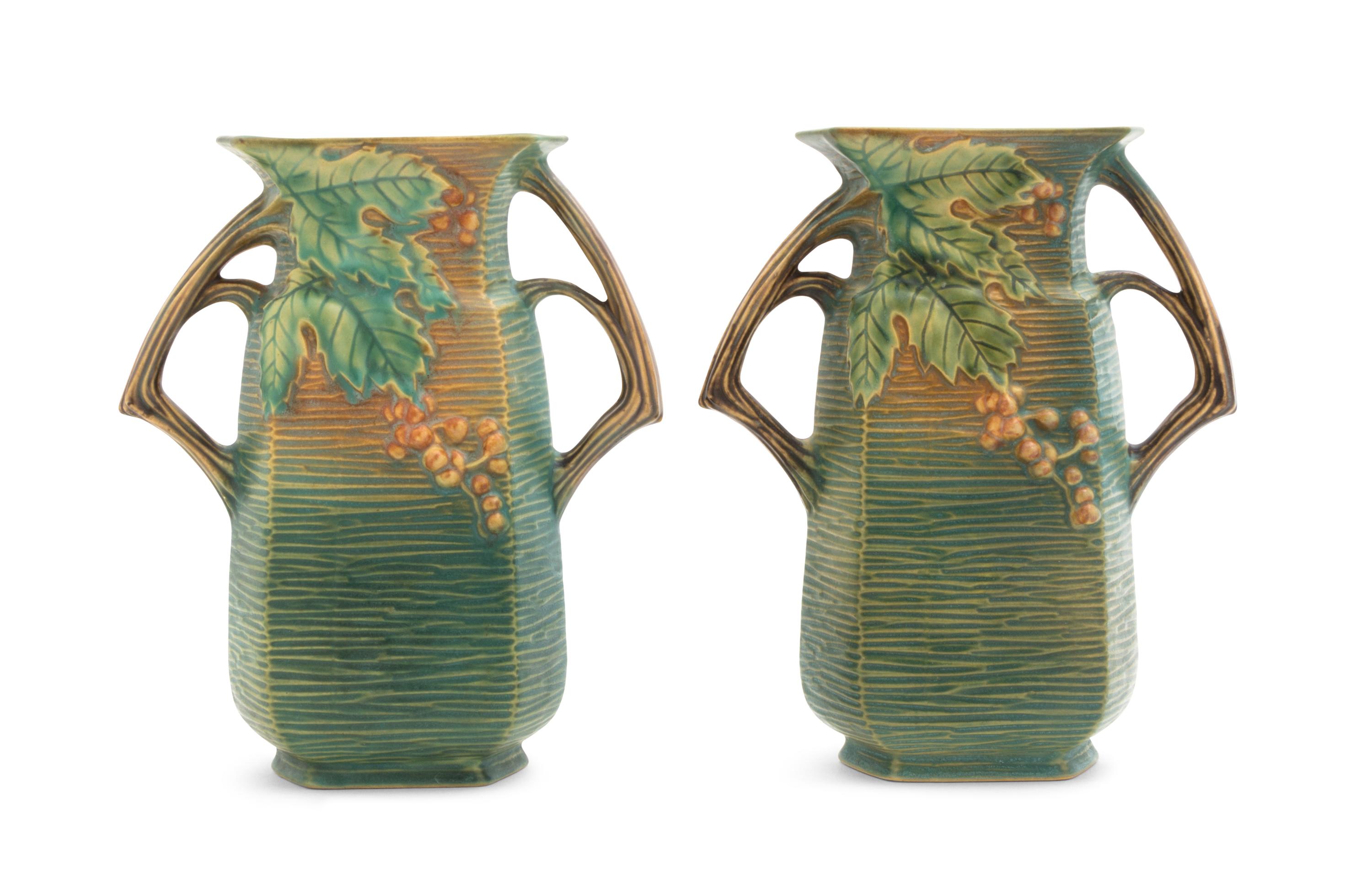 A Pair of Roseville Bushberry Pottery Vases Height 8 1/4 inches.