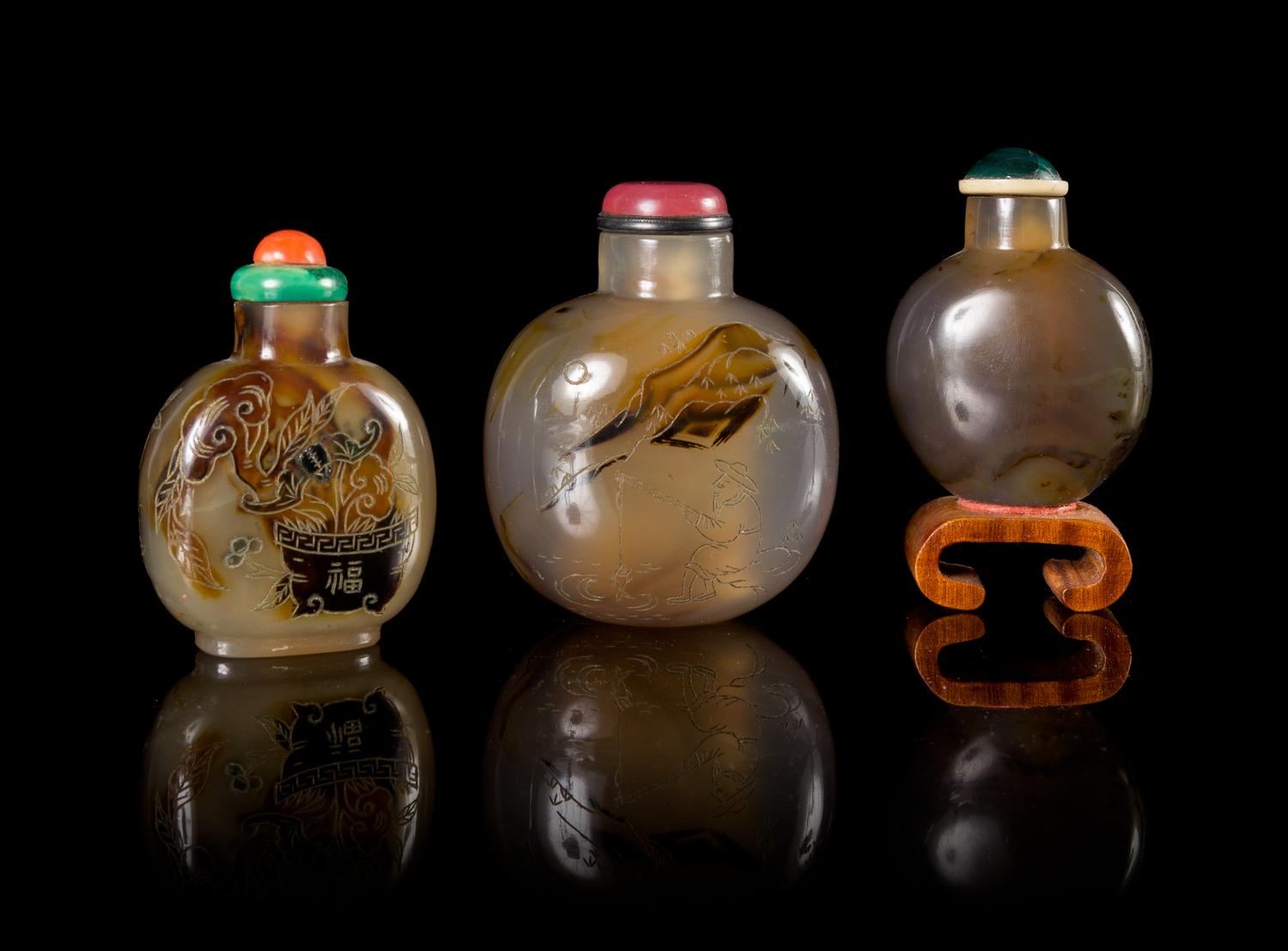 Three Carved Agate Snuff Bottles