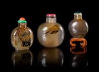 Three Carved Agate Snuff Bottles