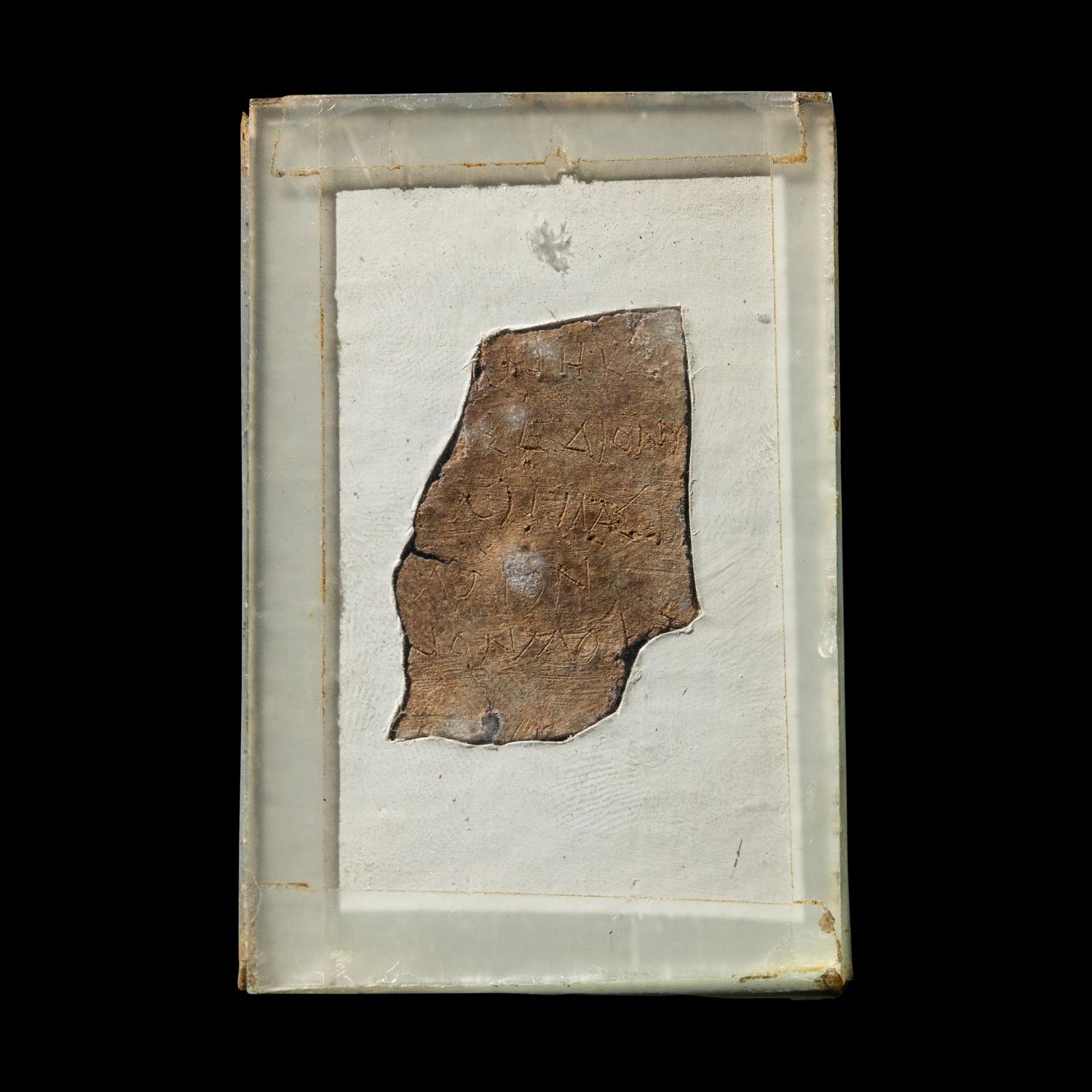 A Roman Lead Fragment with Greek Inscription