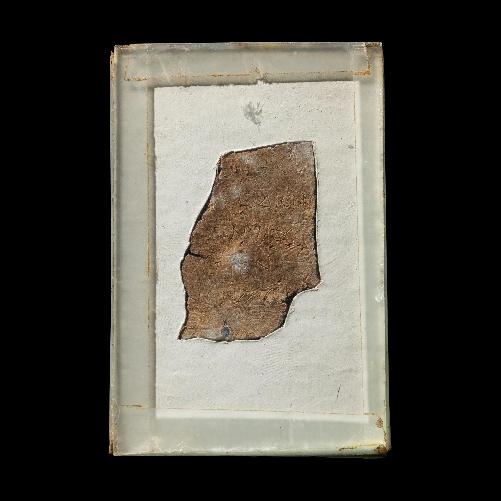 A Roman Lead Fragment with Greek Inscription