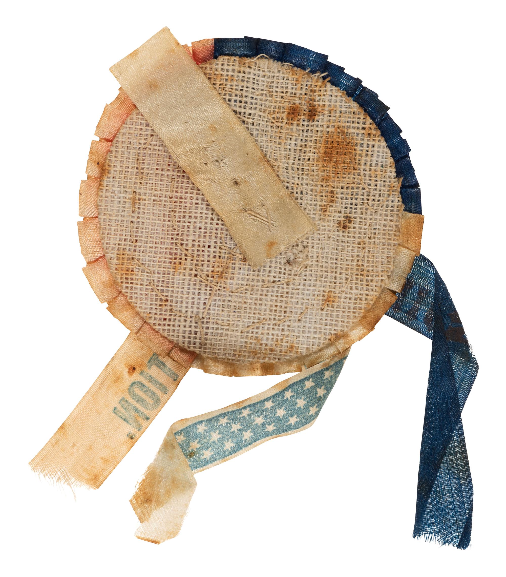 [LINCOLN, Abraham (1809-1865)]. Tri-colored 1864 campaign cockade with Lincoln ferrotype at center.