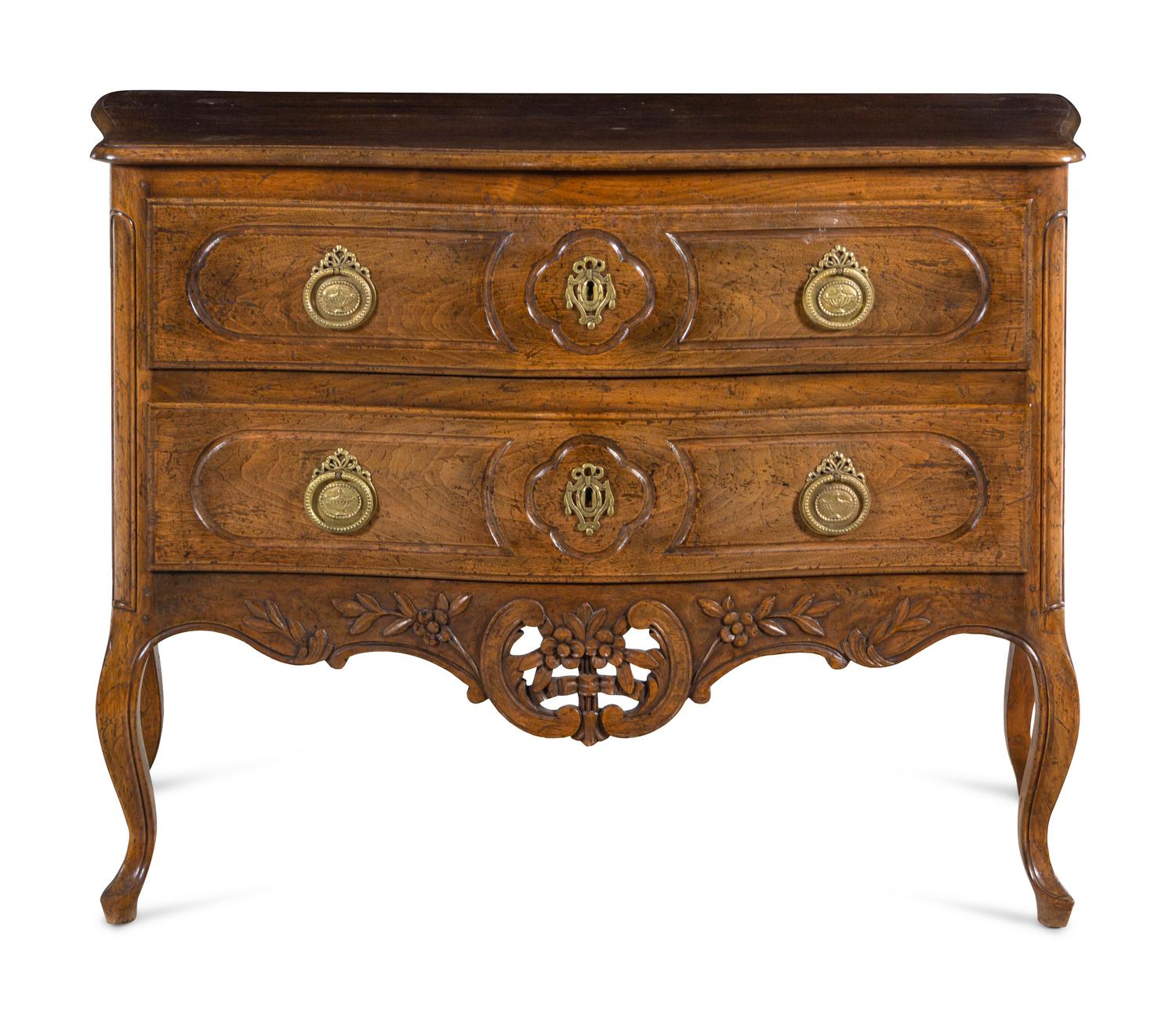A Louis XV Style Walnut Commode