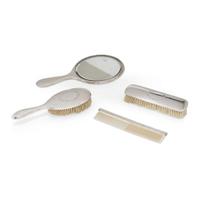 An assembled silver four-piece dressing set various makers, 20th century