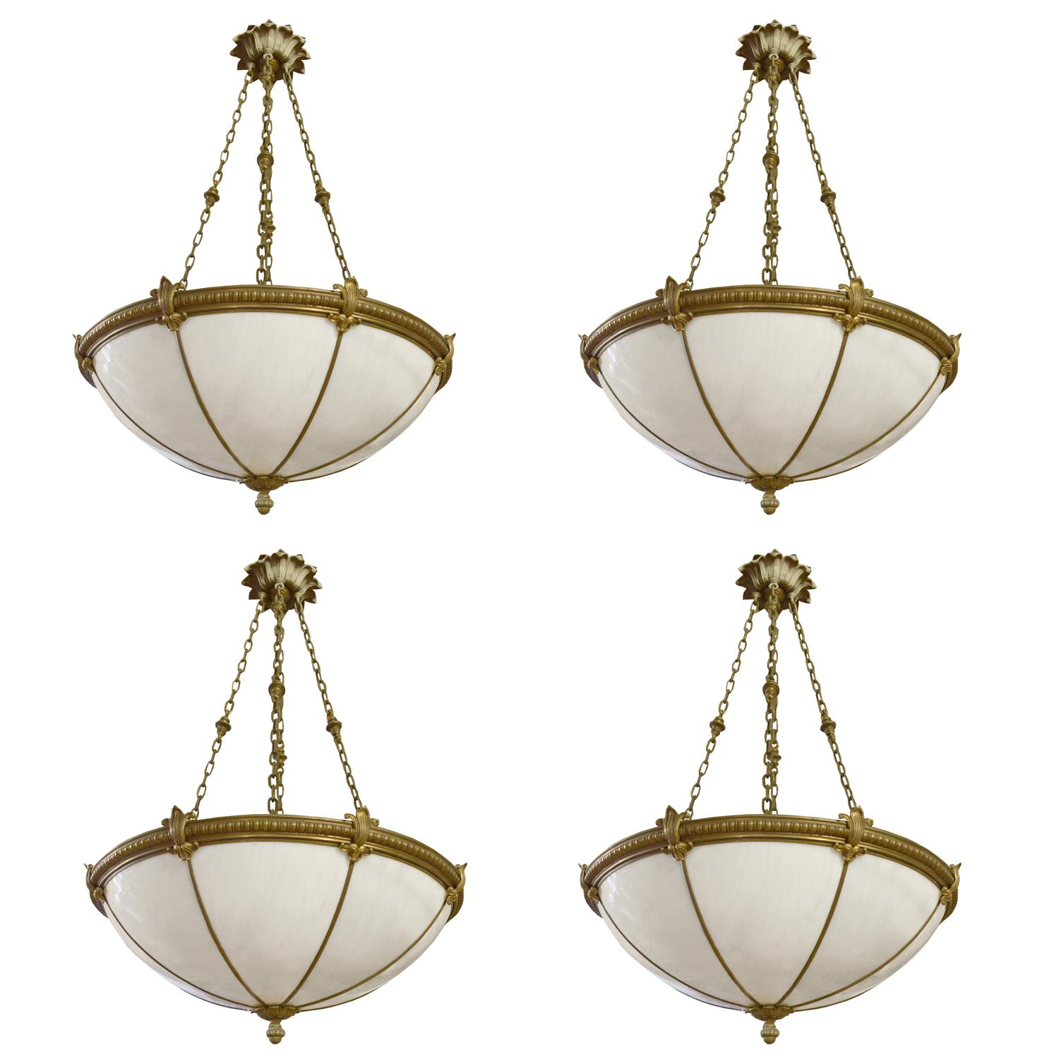 A Set of Four Bronze and Glass Chandeliers 24" W x 24" D x 44" H — United States, Circa 1920