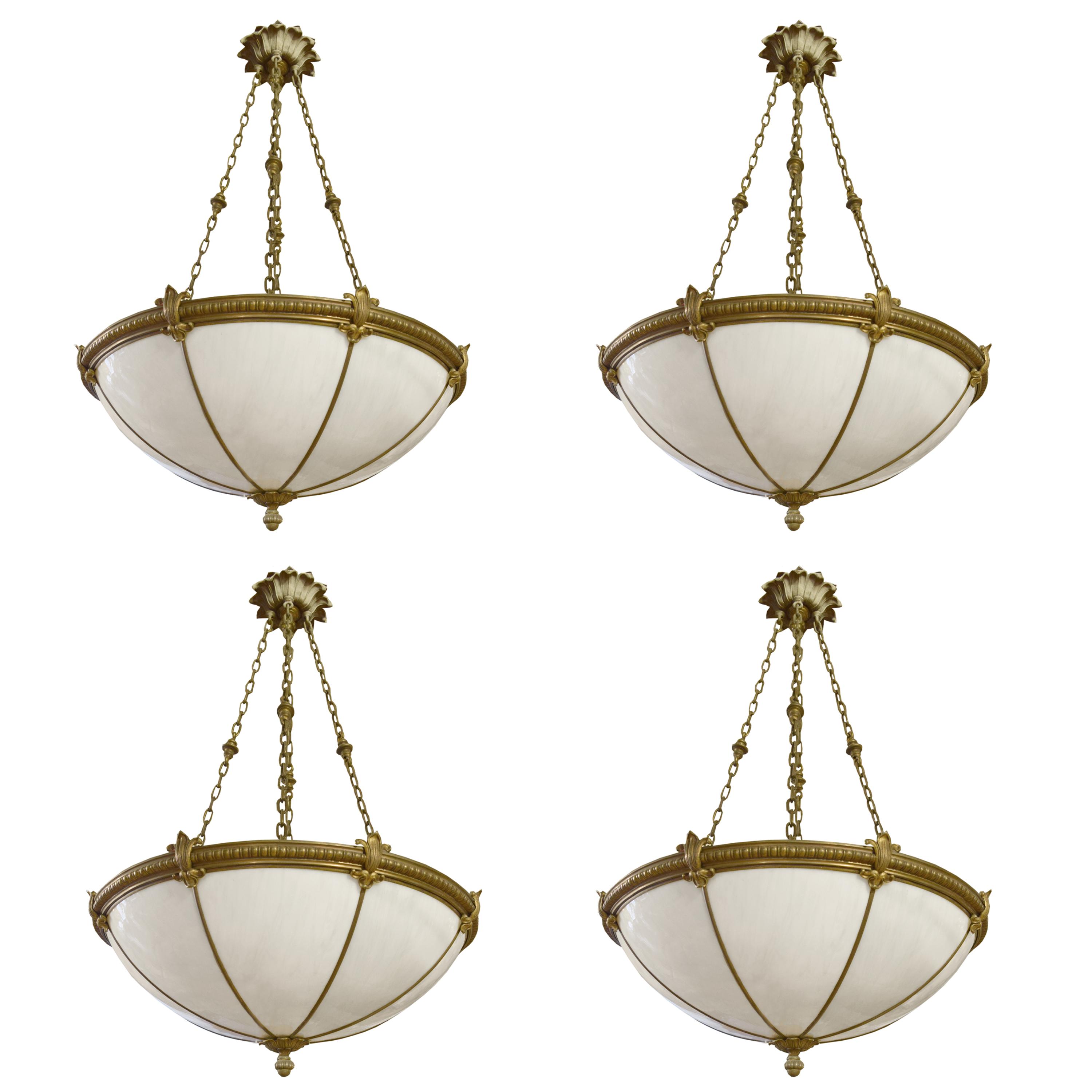 A Set of Four Bronze and Glass Chandeliers 24" W x 24" D x 44" H — United States, Circa 1920