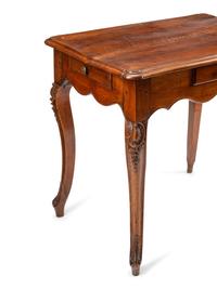 A Louis XV Walnut Four-Drawer Table