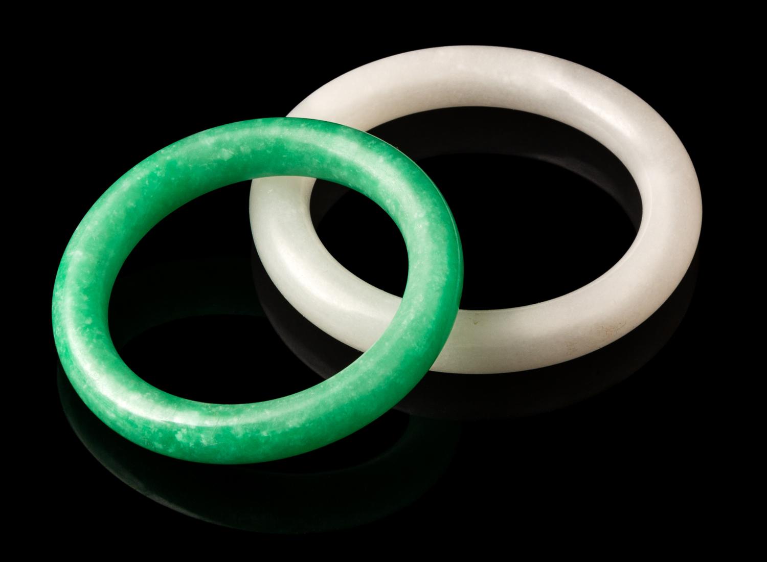 Two Jadeite Bangles Diameter of larger 3 3/8 inches.