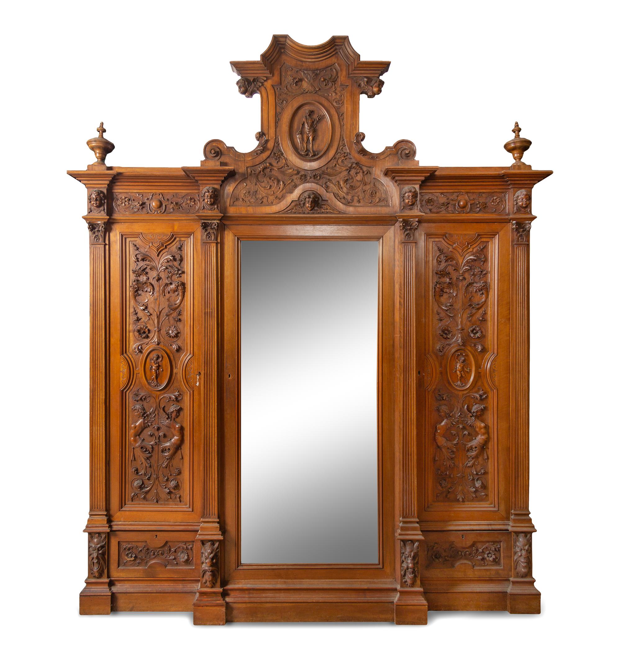 An Italian Renaissance Revival Carved Walnut Armoire