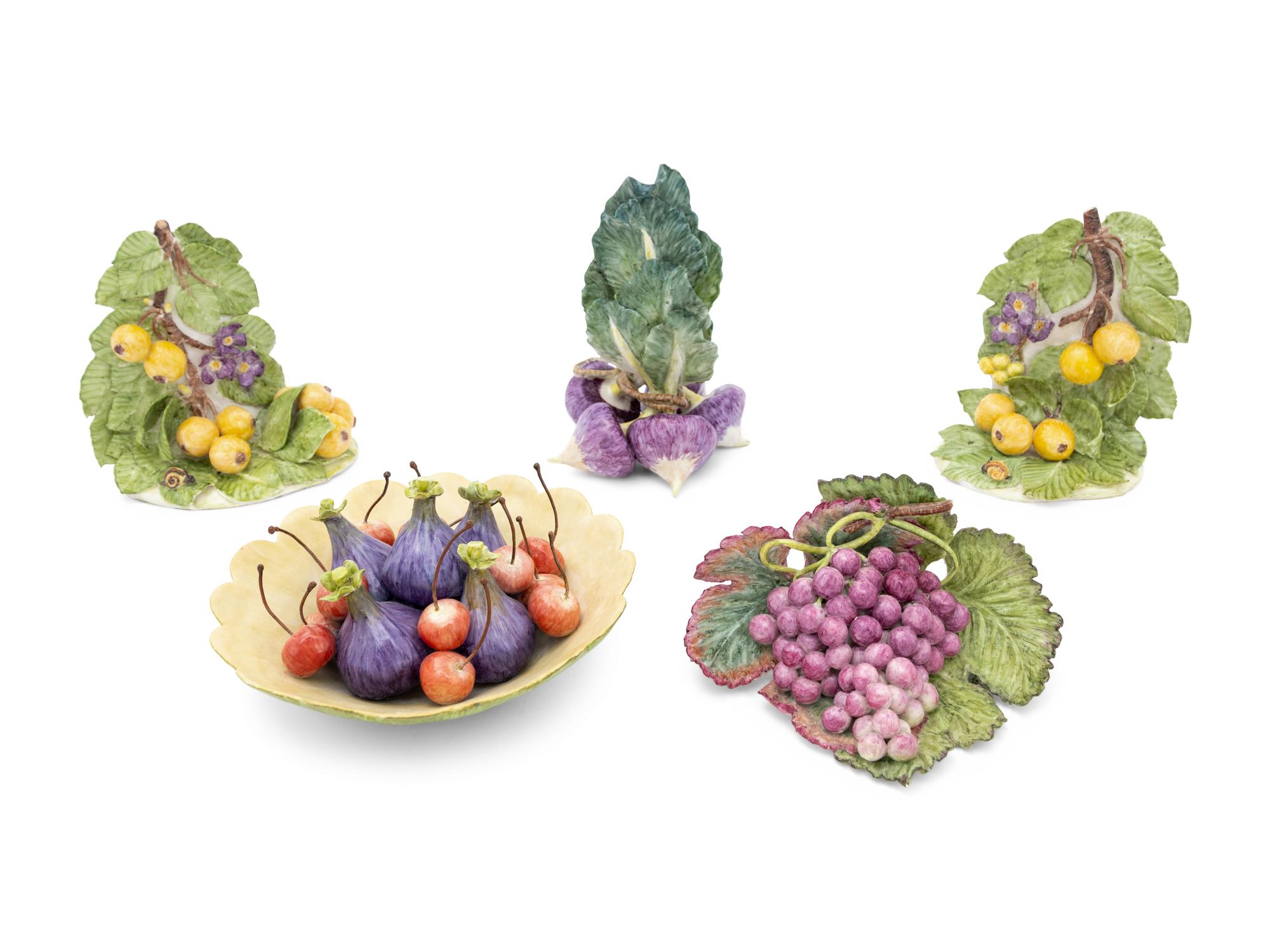 A Collection of Eleven Assorted Ceramic Fruit and Vegetable Articles in the Style of Eva Gordon