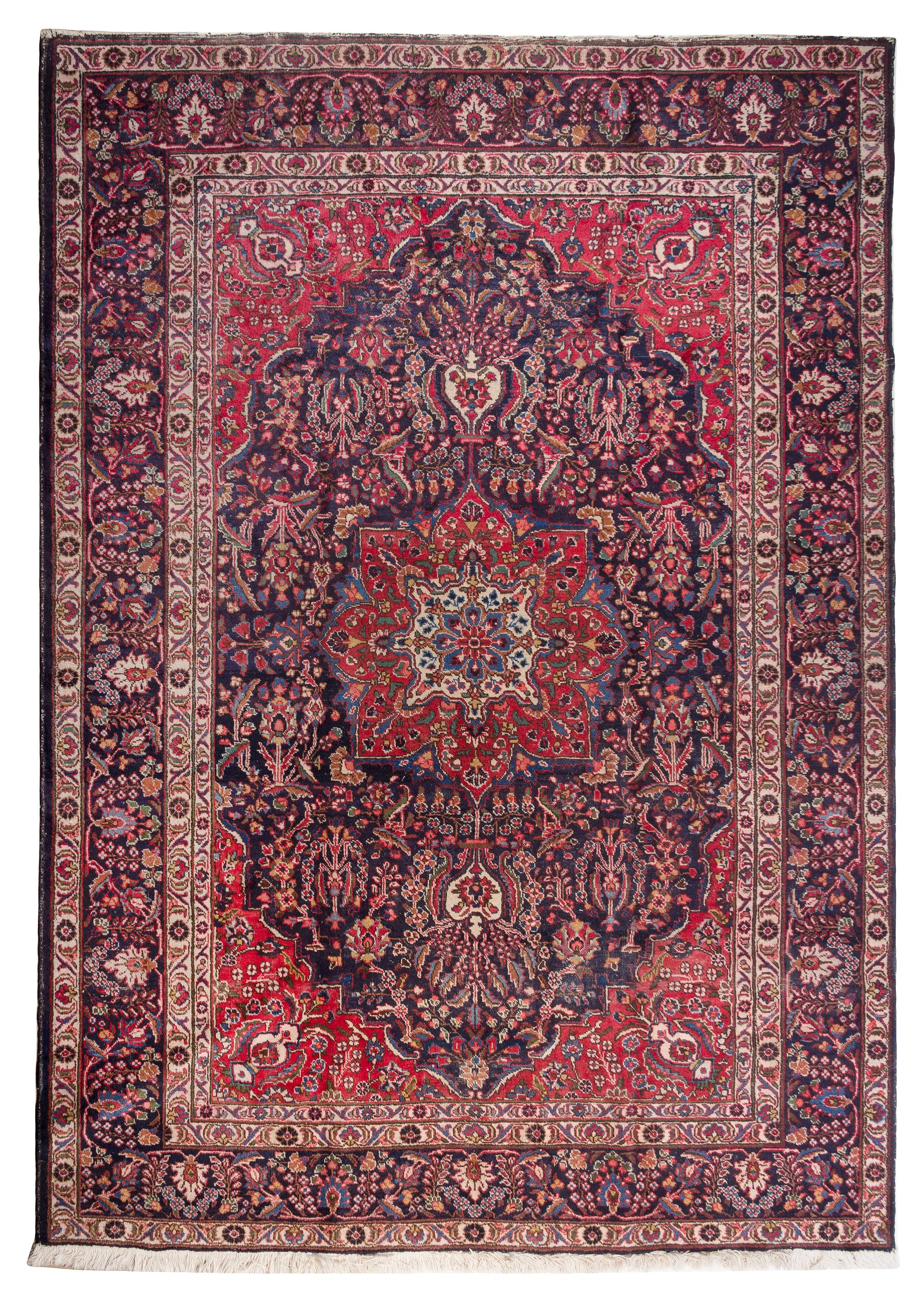 A Tabriz Wool Rug 9 feet 4 1/2 inches x 6 feet 8 1/4 inches.