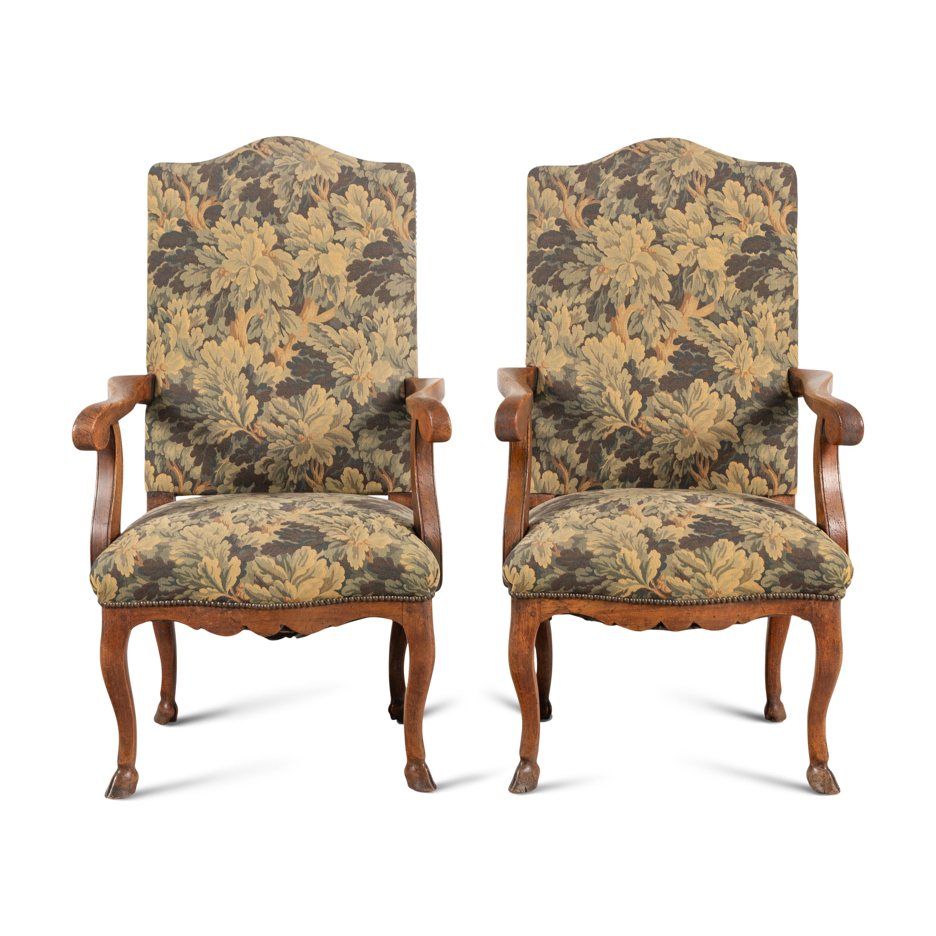 A Pair of Provincial Régence Walnut Armchairs