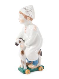 A Meissen Porcelain Figure of a Boy on a Pull Toy, by Konrad Hentschel