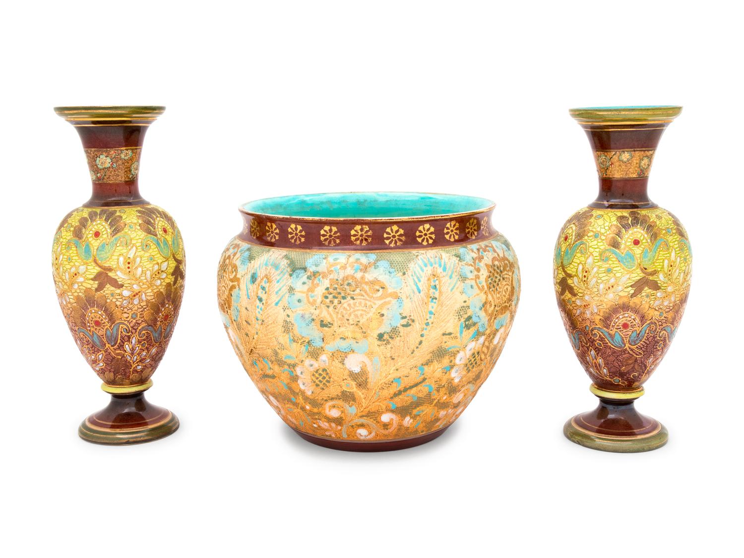A Pair of Doulton Lambeth Stoneware Vases and a Doulton Lambeth Stoneware Jardinière