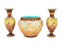 A Pair of Doulton Lambeth Stoneware Vases and a Doulton Lambeth Stoneware Jardinière