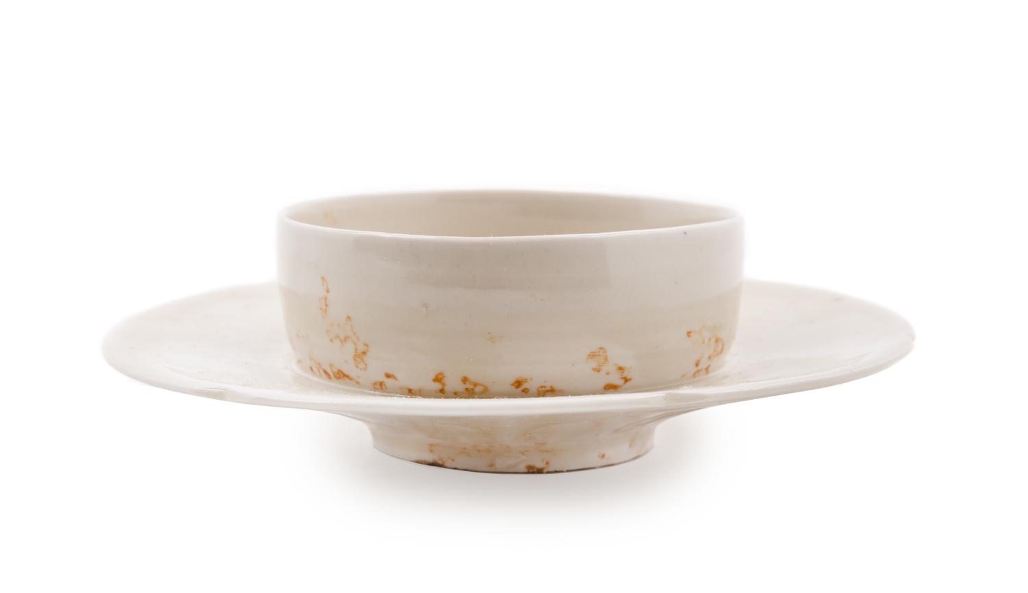 A Chinese Dingyao White Glazed Porcelain Cup and Stand
