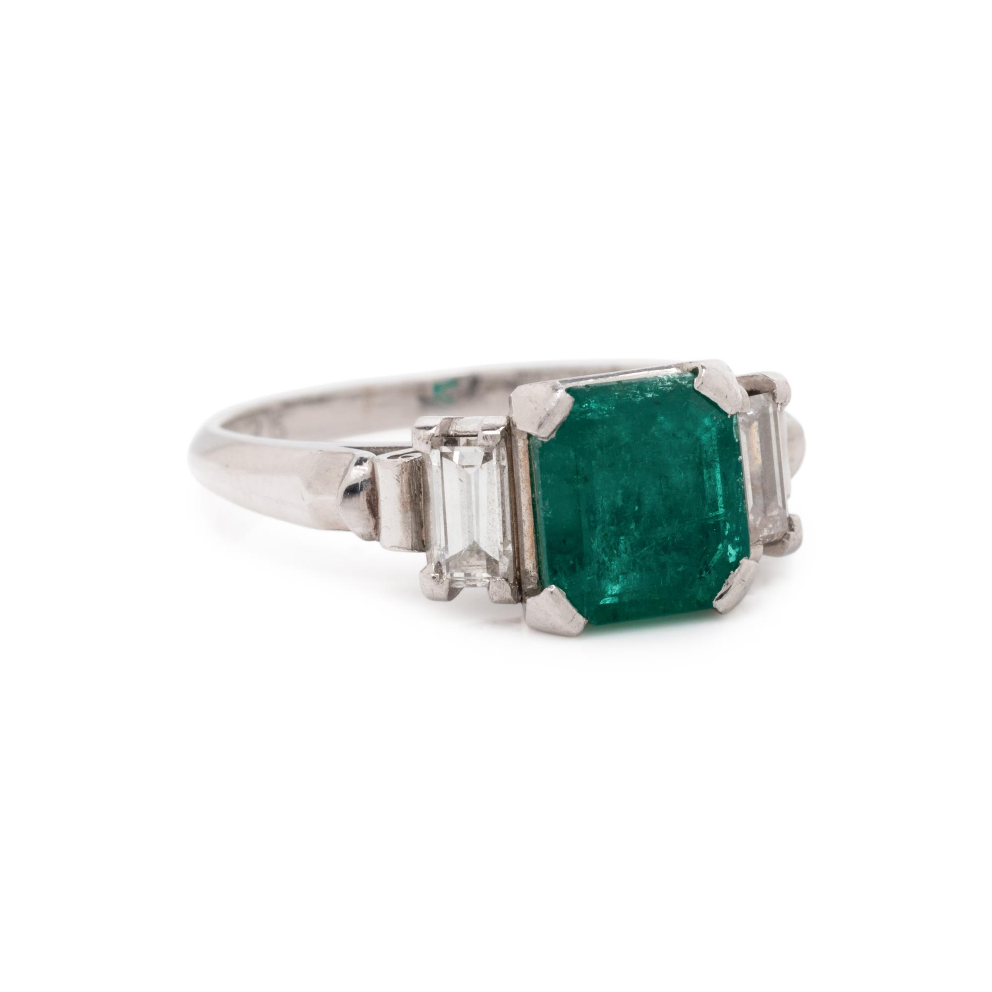 PLATINUM, EMERALD, AND DIAMOND RING