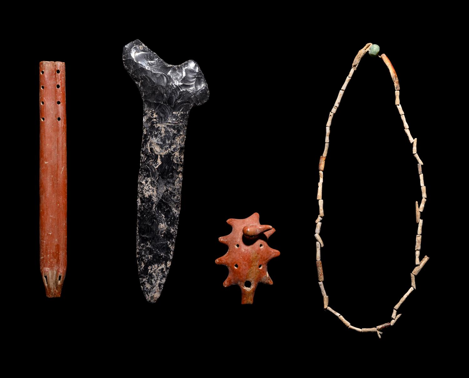 A Group of Four Pre-Columbian Articles: Whistle, Flute, Blade and Necklace