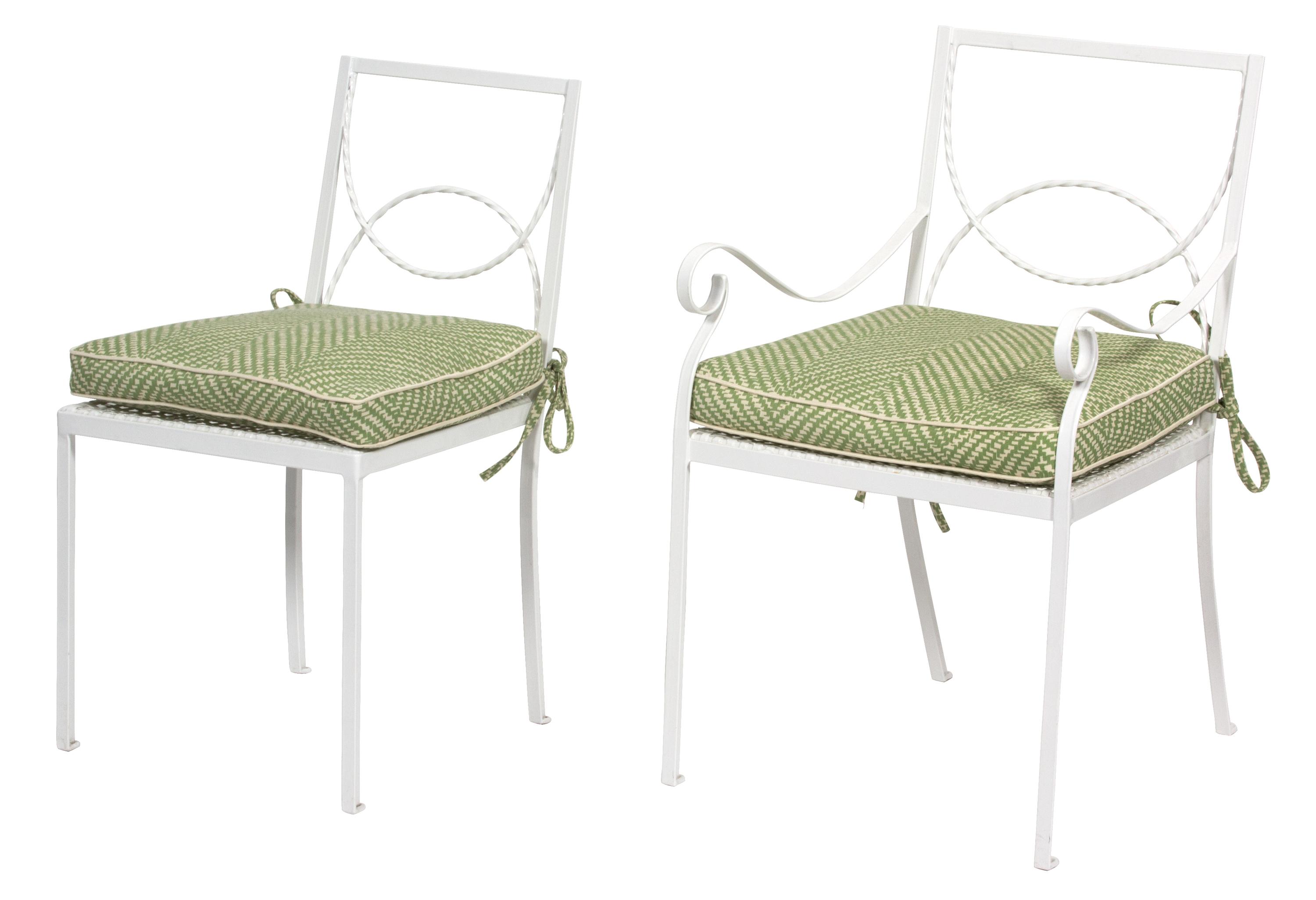 A Group of White Painted Iron Garden Furniture Dining table height 29 x length 60 x width 32 inches. — 20TH CENTURY