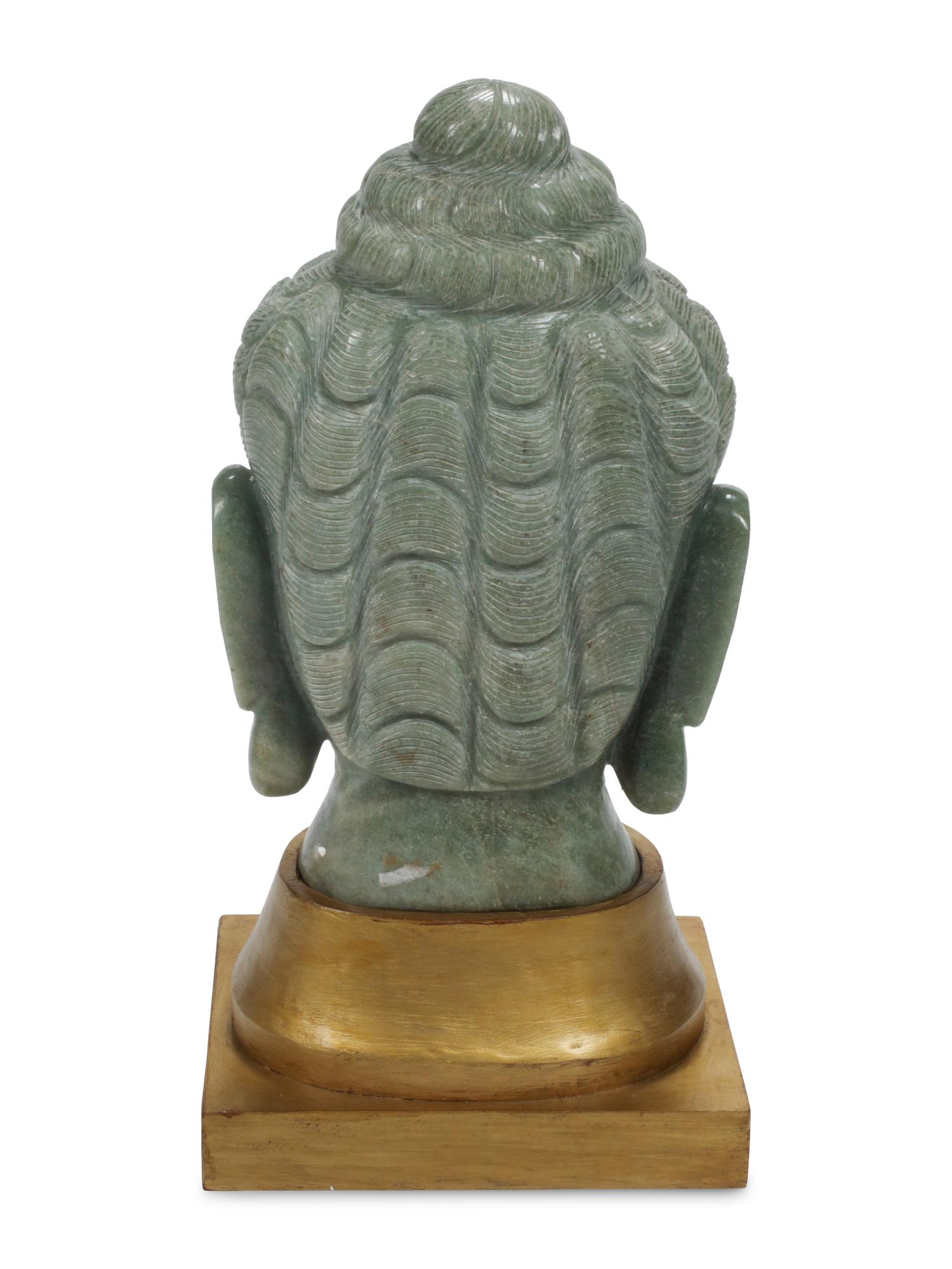 A Carved Green Jasper Head of Buddha