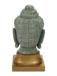 A Carved Green Jasper Head of Buddha