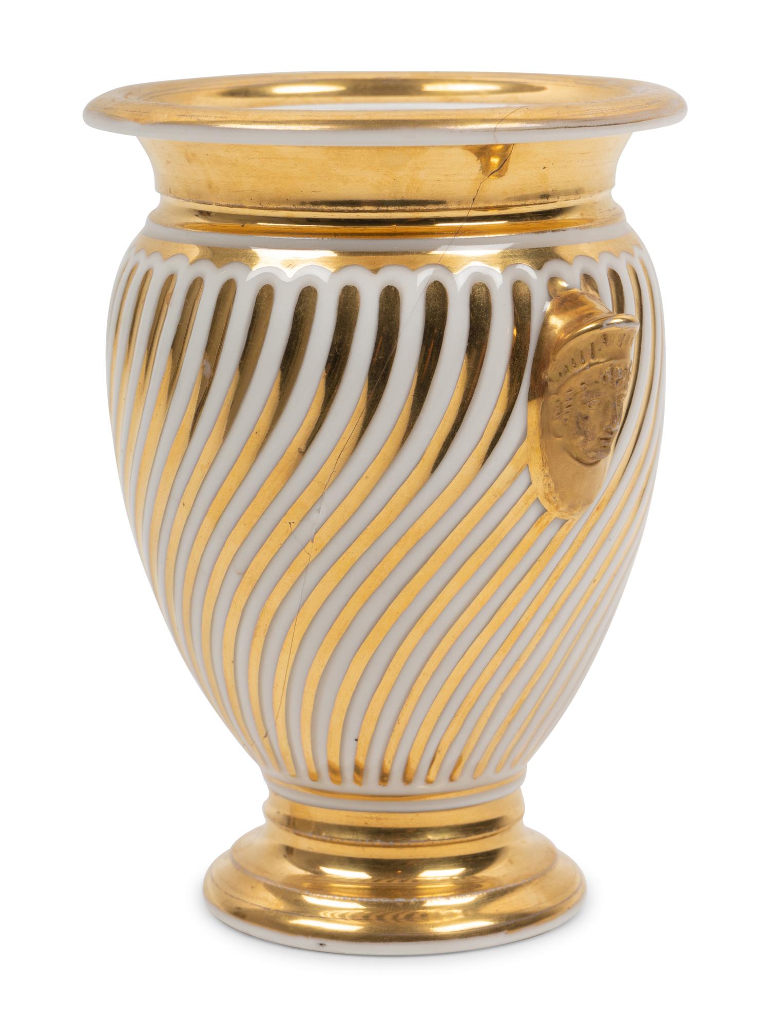 A Continental Parcel Gilt Porcelain Spiral Molded Vase