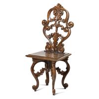 A Set of Five German Carved Walnut Side Chairs