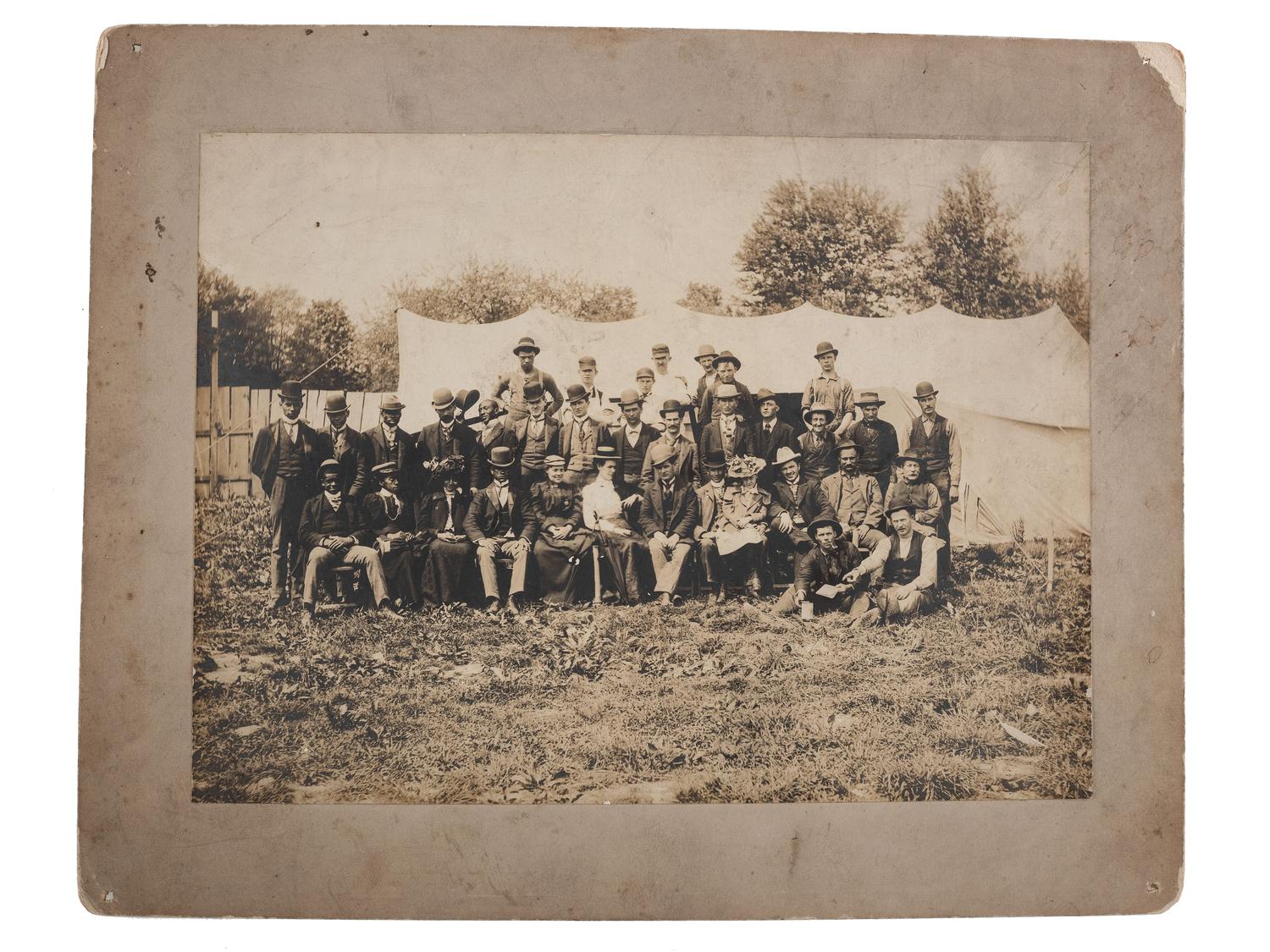 [EARLY PHOTOGRAPHY] -- [RELIGION]. ARCHIBALD, F.R., photographer. Photograph of possible integrated revival meeting showing both African American and white subjects. Ridge Creek, OH, ca 1900.