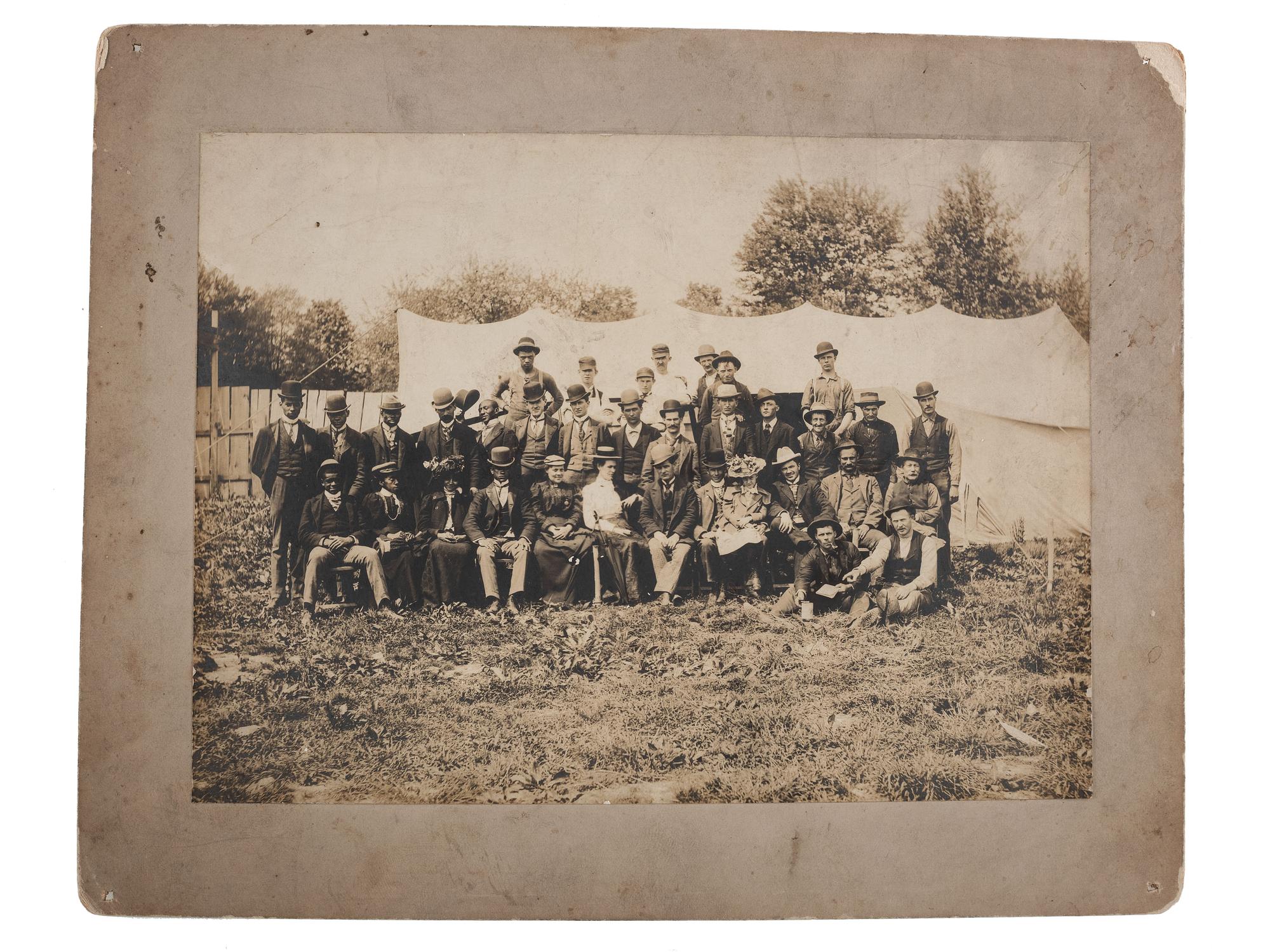 [EARLY PHOTOGRAPHY] -- [RELIGION]. ARCHIBALD, F.R., photographer. Photograph of possible integrated revival meeting showing both African American and white subjects. Ridge Creek, OH, ca 1900.