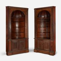 A Pair of George III Style Carved Pine Corner Cabinets late 19th/early 20th century, with later modifications